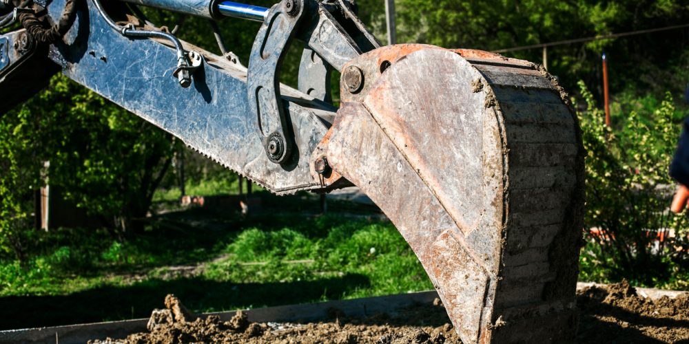 Excavator,Used,For,Pipe,Laying,Works,And,House,Foundation.,Digging