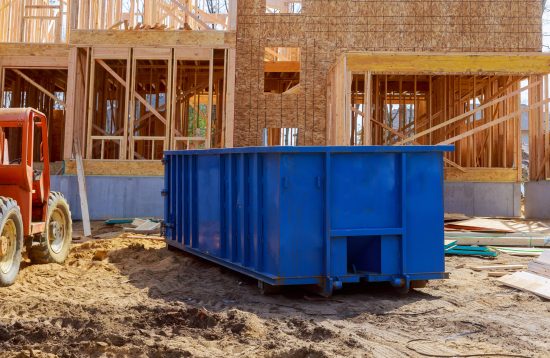 Blur,Dumpster,,Recycle,Waste,And,Garbage,Bins,Near,New,Construction