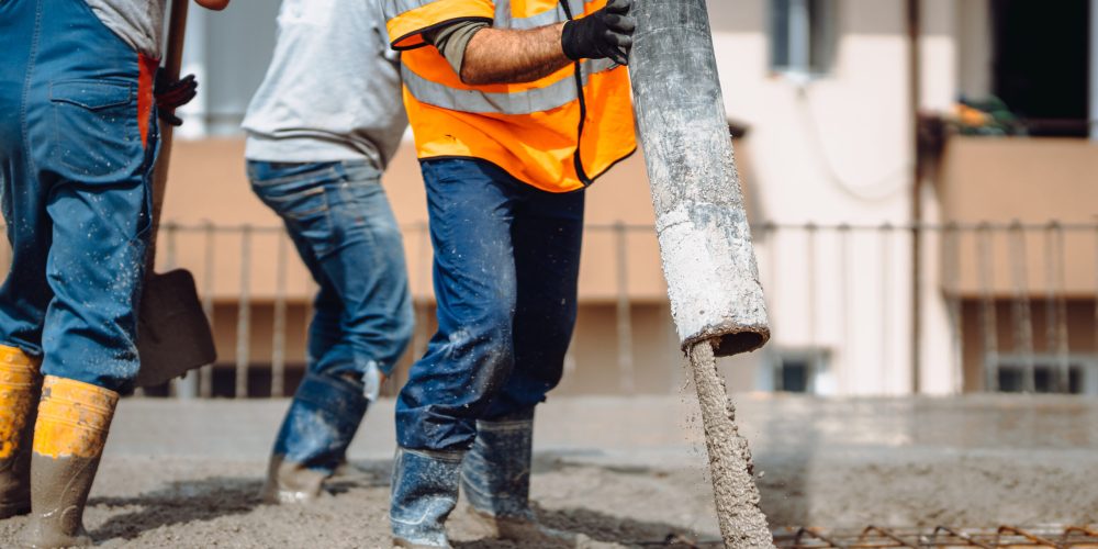 Construction,Details,-,Worker,Laying,And,Pouring,Cement,Or,Concrete