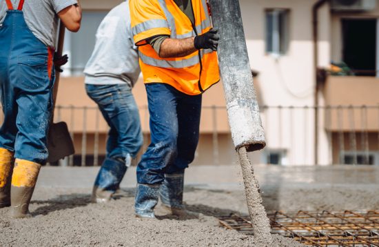 Construction,Details,-,Worker,Laying,And,Pouring,Cement,Or,Concrete