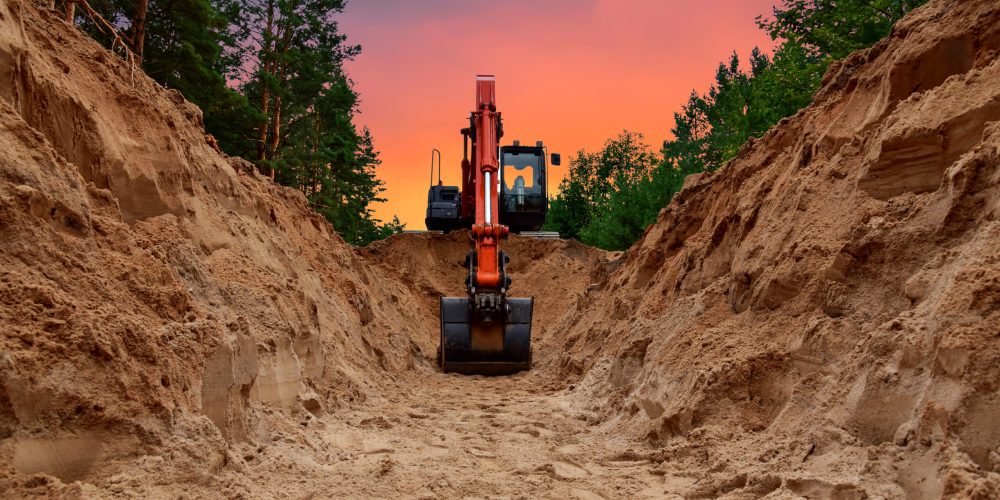 Excavator,Dig,Trench,At,Forest,Area,On,Amazing,Sunset,Background.